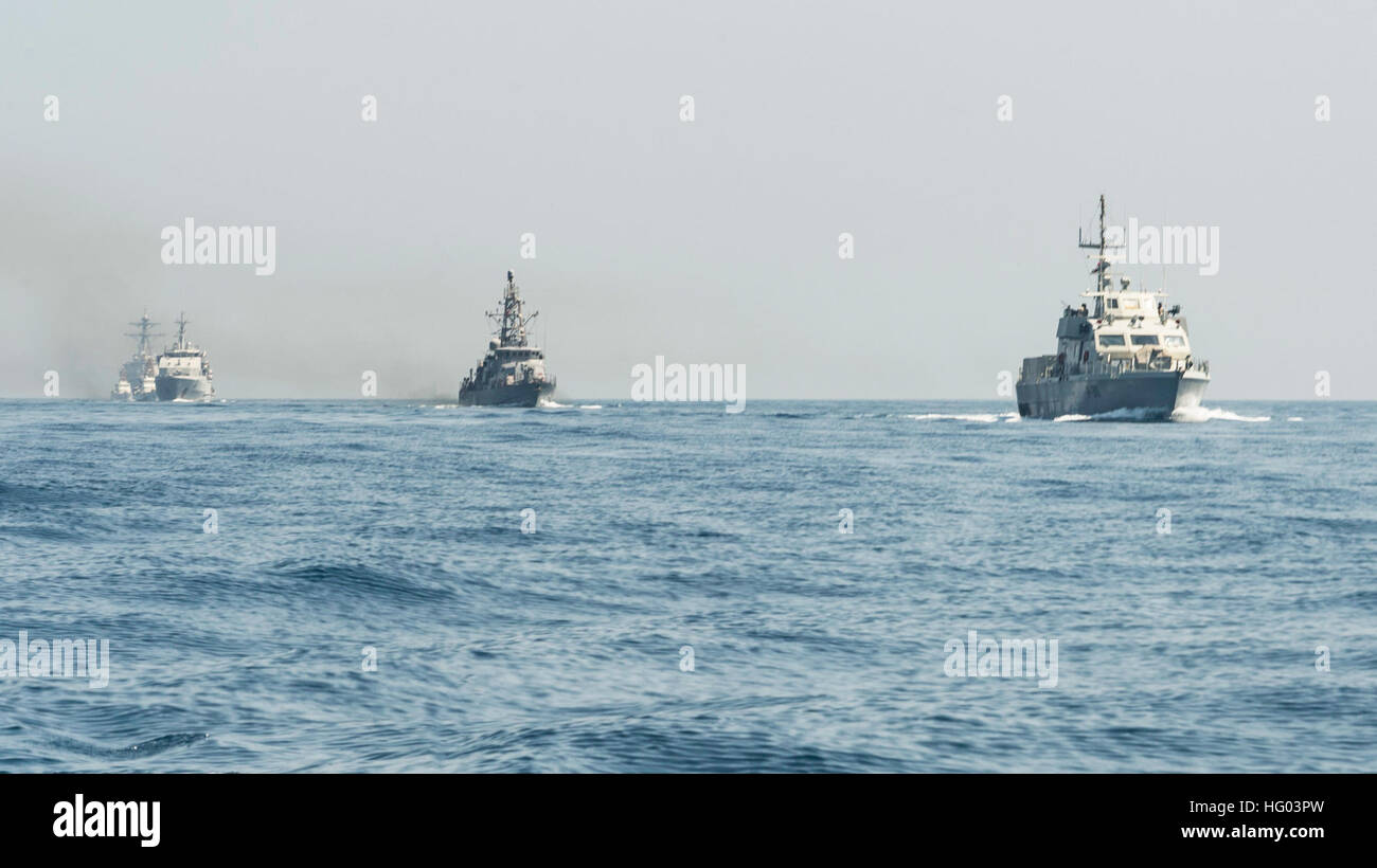 160815-N-GP524-138 ARABIAN GULF (Aug. 15, 2016) From left rear to right, the U.S. Navy guided-missile destroyer USS Stout (DDG 55), rear, the U.S. Coast Guard Island-class patrol cutters USCGC Wrangell (WPB 1332) and USCGC Monomoy (WPB 1326), the Iraqi navy Al Basra-class offshore support vessel Al Basra (OSV 401), the U.S. Navy Cyclone-class coastal patrol ship USS Monsoon (PC 4) and the Iraqi navy Swift Boat (P-311) transit in formation as part of a Commander, Task Force 55 bilateral exercise. The U.S. participates in bilateral exercises with partner nations routinely to build and strengthen Stock Photo