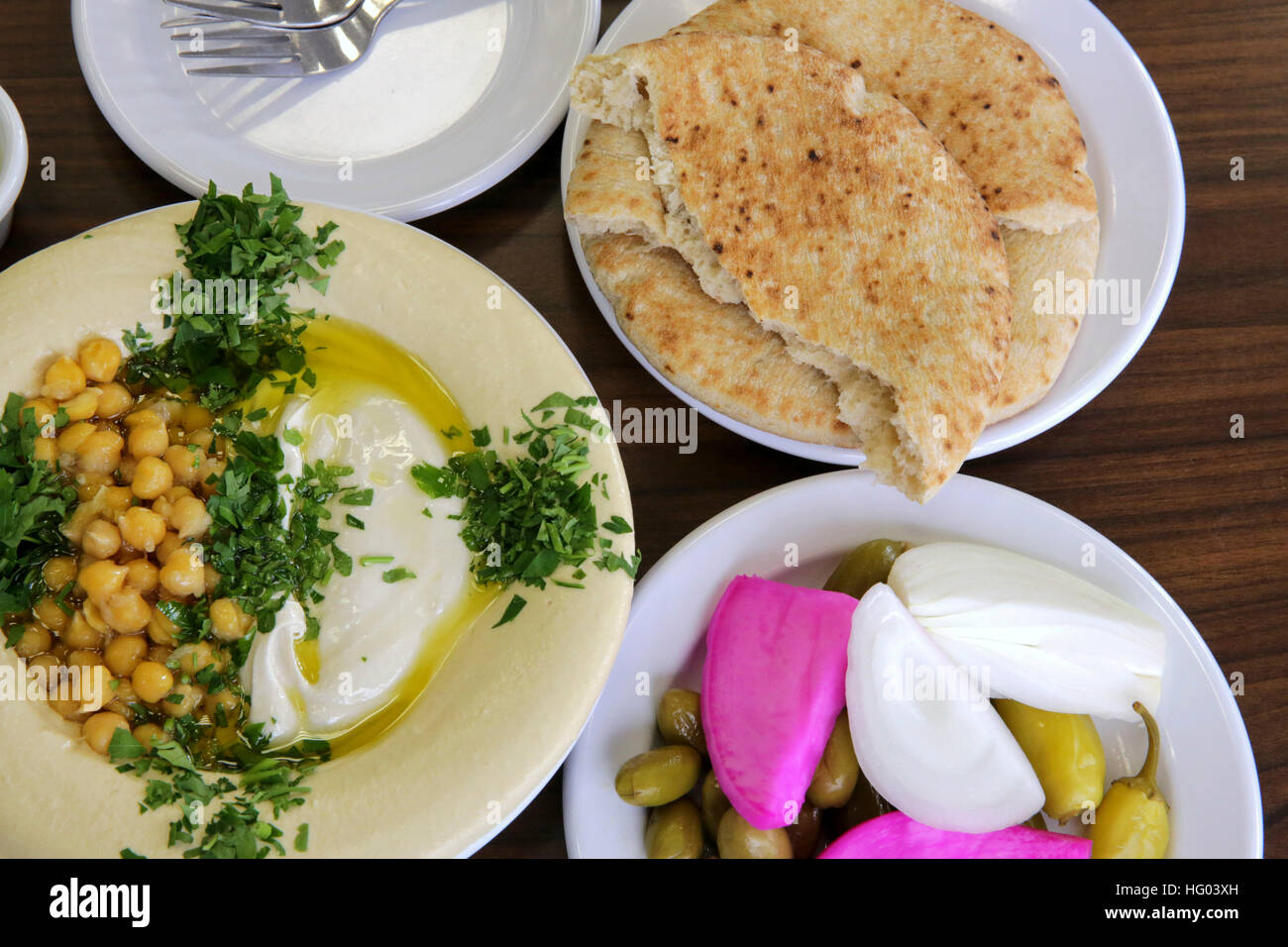 Hummus. A Levantine Arab dip or spread made from cooked, mashed ...
