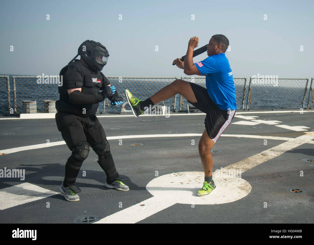 161003-N-GP524-508 ARABIAN GULF (Oct. 3, 2016) Ensign Carlos Ramos, right , conducts defensive fighting techniques after being sprayed with oleoresin capsicum during a security reaction forces-basic training evolution aboard the guided-missile destroyer USS Stout (DDG 55). Stout, deployed as part of the Eisenhower Carrier Strike Group, is supporting maritime security operations and theater security cooperation efforts in the U.S. 5th Fleet area of operations. (U.S. Navy photo by Petty Officer 3rd Class Bill Dodge) USS STOUT (DDG 55) DEPLOYMENT 2016 161003-N-GP524-508 Stock Photo