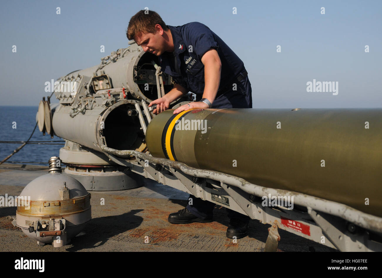 111019-N-XQ375-229  ARABIAN SEA (Oct. 19, 2011) Sonar Technician 2nd Class Jesse Lindsey performs maintenance on a MK-32 surface vessel torpedo aboard the guided-missile destroyer USS Mitscher (DDG 57). Mitscher is deployed to the U.S. 5th Fleet area of responsibility conducting maritime security operations and support missions. (U.S. Navy photo by Mass Communication Specialist 3rd Class Deven B. King/Released) US Navy 111019-N-XQ375-229 Sonar Technician 2nd Class Jesse Lindsey performs maintenance on a MK-32 surface vessel torpedo aboard the guided-missil Stock Photo