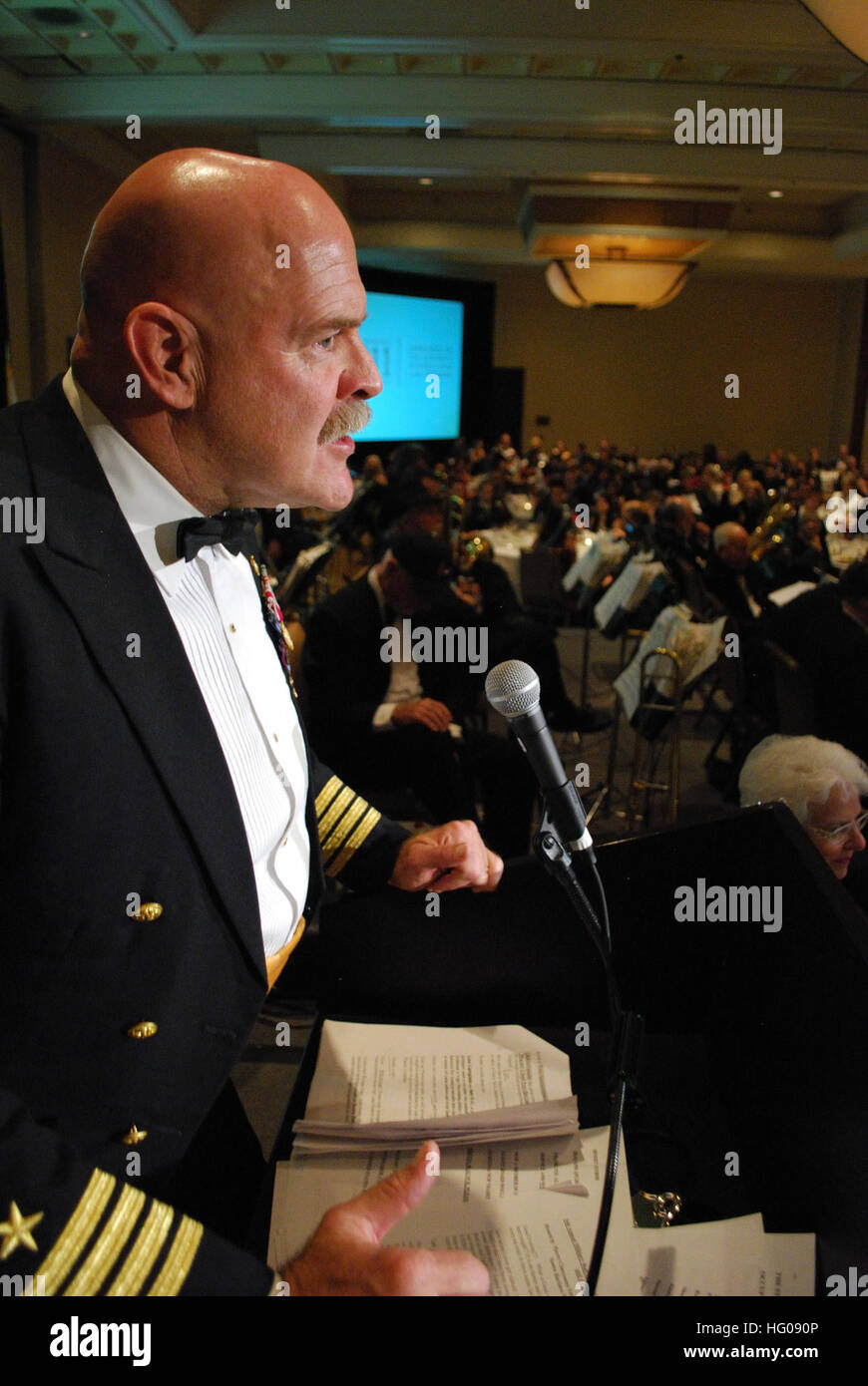 111112-N-HP195-009 SANTA BARBARA, Calif. (Nov. 12, 2011) Retired Capt. Michael Argos, a former Navy SEAL, speaks at the 16th Annual Military Ball to recognize the loss of the more than 30 American lives in an August 6th crash of a Chinook helicopter. The Pierre Claeyssens Veterans' Museum and the Santa Barbara Navy League hosted the ball, which honored veterans and active service members for their many sacrifices. (U.S. Navy photo by Mass Communication Specialist 1st Class Christopher Okula/Released) US Navy 111112-N-HP195-009 Retired Capt. Michael Argos speaks at the 16th Annual Military Ball Stock Photo