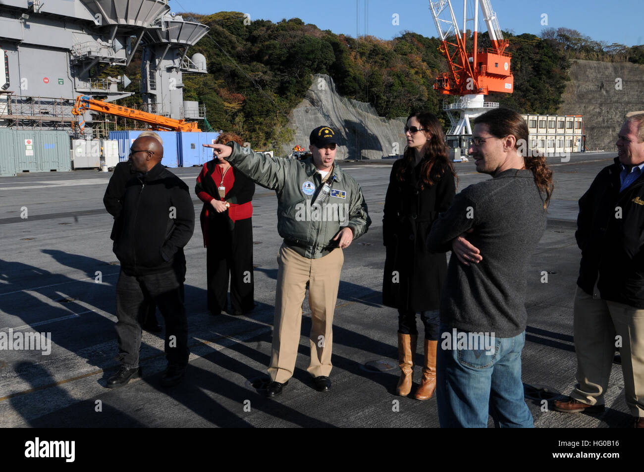 111213-N-JO245-050  YOKOSUKA, Japan (Dec. 13, 2011) Sarah Wayne Callies, a television and movie actress who recently starred as Lori Grimes in the Golden Globe nominated AMC series ÒThe Walking Dead,Ó tours the aircraft carrier USS George Washington (CVN 73) with Lt. cmdr. David Hecht, George Washington's public affairs officer.  George Washington is the Navy's only full-time forward-deployed aircraft carrier ensuring security and stability across the western Pacific Ocean. (U.S. Navy photo by Mass Communication Specialist 3rd Class Justin E. Yarborough/Released) US Navy 111213-N-JO245-050 A m Stock Photo