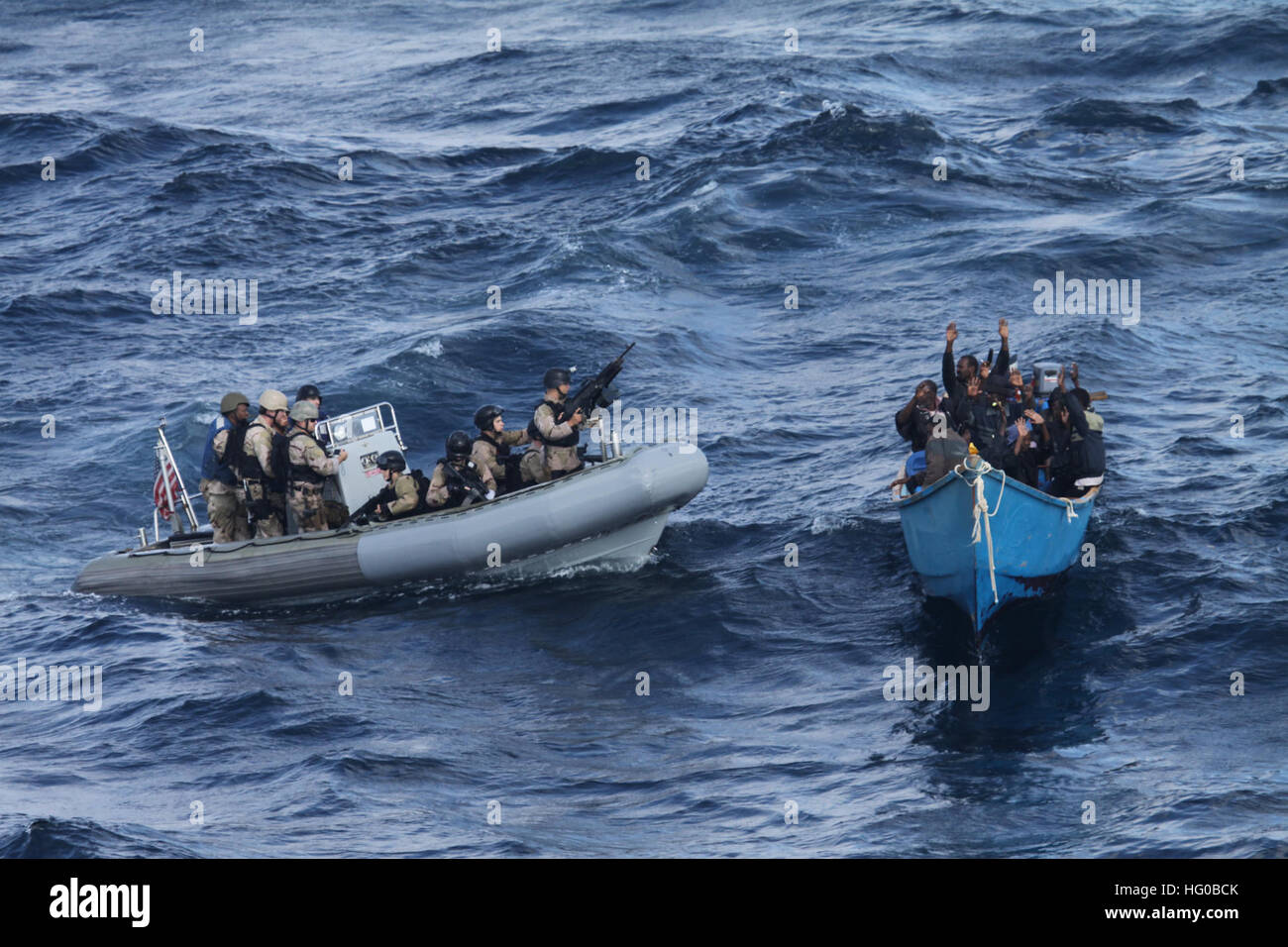 Visit, board, search, and seizure team from guided-missile destroyer USS Pinckney (DDG 91) approaches a suspected pirate vessel following attack on Motor Vessel Nordic Apollo, operating under Combined Task Force 151 for counter-piracy in Gulf of Aden and surrounding waters. Stock Photo