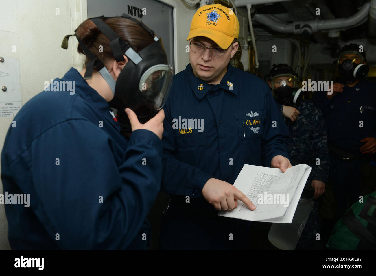 Machinist's Mate Chief Joshua Mills helps Machinist's Mate 2nd Class ...