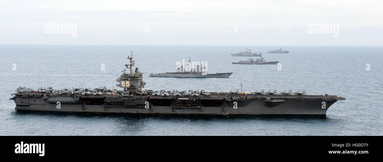 120123-N-JL826-156 ATLANTIC OCEAN (Jan. 23, 2012) The aircraft carrier USS Enterprise (CVN 65), bottom, the Ticonderoga-class guided-missile cruiser USS Vicksburg (CG 69), the Arleigh Burke-class guided-missile destroyers USS James E. Williams (DDG 95), USS Porter (DDG 78), USS McFaul (DDG 74), USS Cole (67) and USS Nitze (DDG 94) maneuver into formation during the Enterprise Carrier Strike Group’s composite training unit exercise (COMPTUEX). (U.S. Navy photo by Mass Communication Specialist 2nd Class Brooks B. Patton, Jr./Released) US Navy 120123-N-JL826-156 The Enterprise Carrier Strike Grou Stock Photo