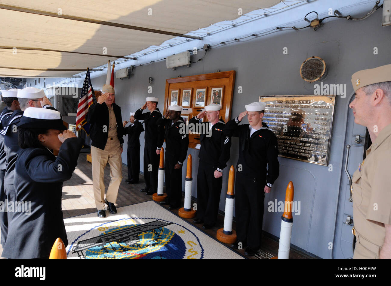 Side boys render honors as Adm. Samuel Locklear, commander of U.S. Pacific Command, crosses the