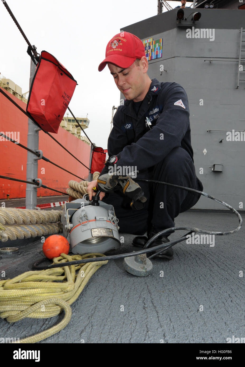 John Prokop rigs a water line security light on the foc'sle of the Oliver Hazard Perry-class guided-missile frigate USS Underwood (FFG 36) while moored in Callao, Peru after completing the at-sea component of Silent Forces Exercise. Underwood is representing the U.S. Navy during SIFOREX and is deployed to Central and South America and the Caribbean in support of Southern Seas 2012. (U.S. Navy photo by Mass Communication Specialist 2nd Class Stuart Phillips) USS Underwood action 120531-N-NL541-102 Stock Photo