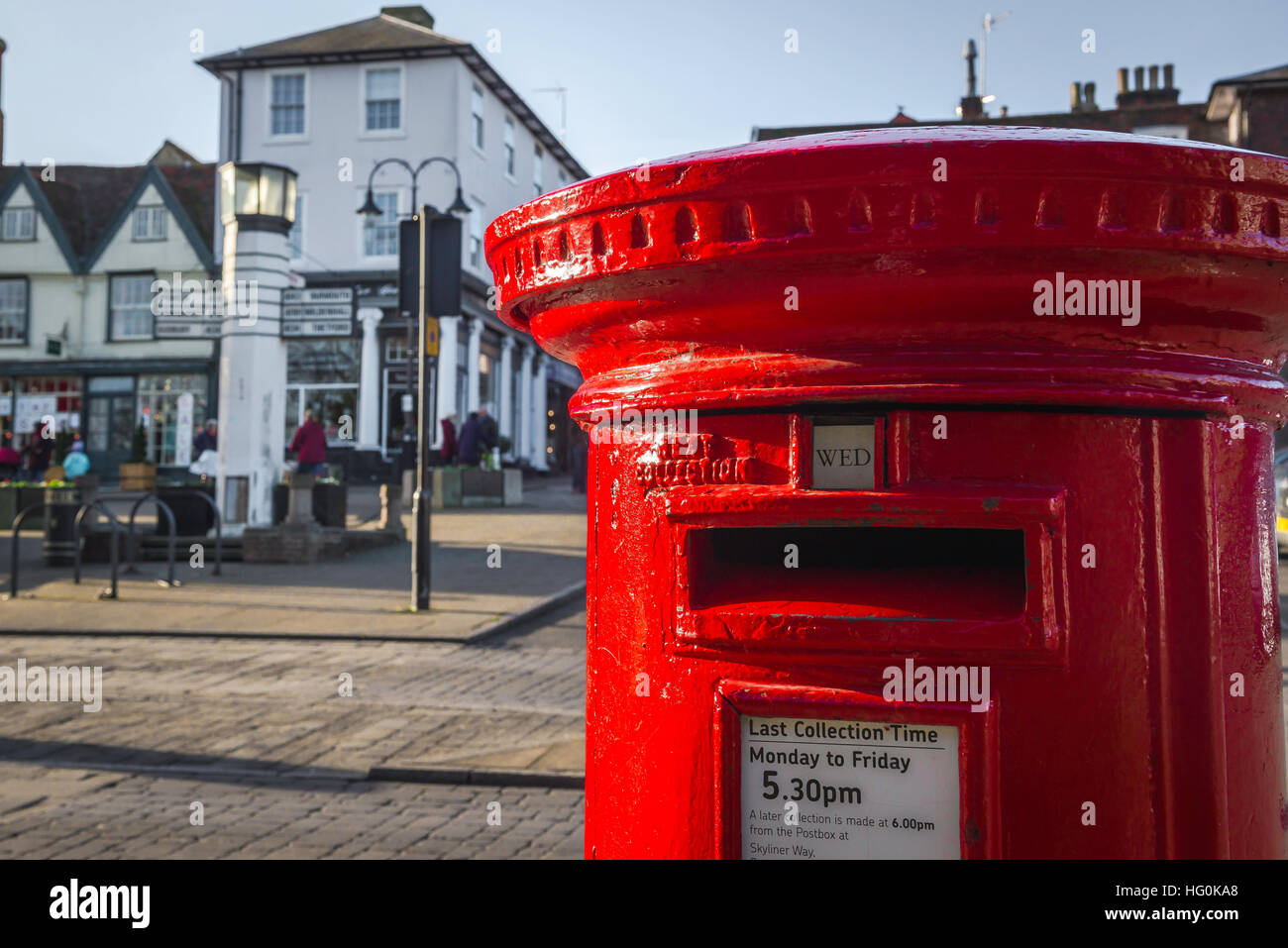 Red pillar box, view of the upper detail of a red pillar box sited on