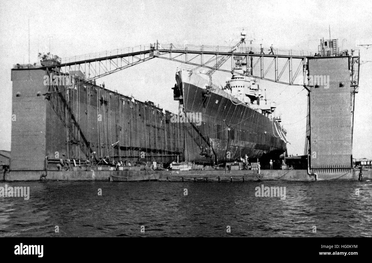 USS Columbia (CL-56), a Cleveland-class light cruiser, is shown docked ...