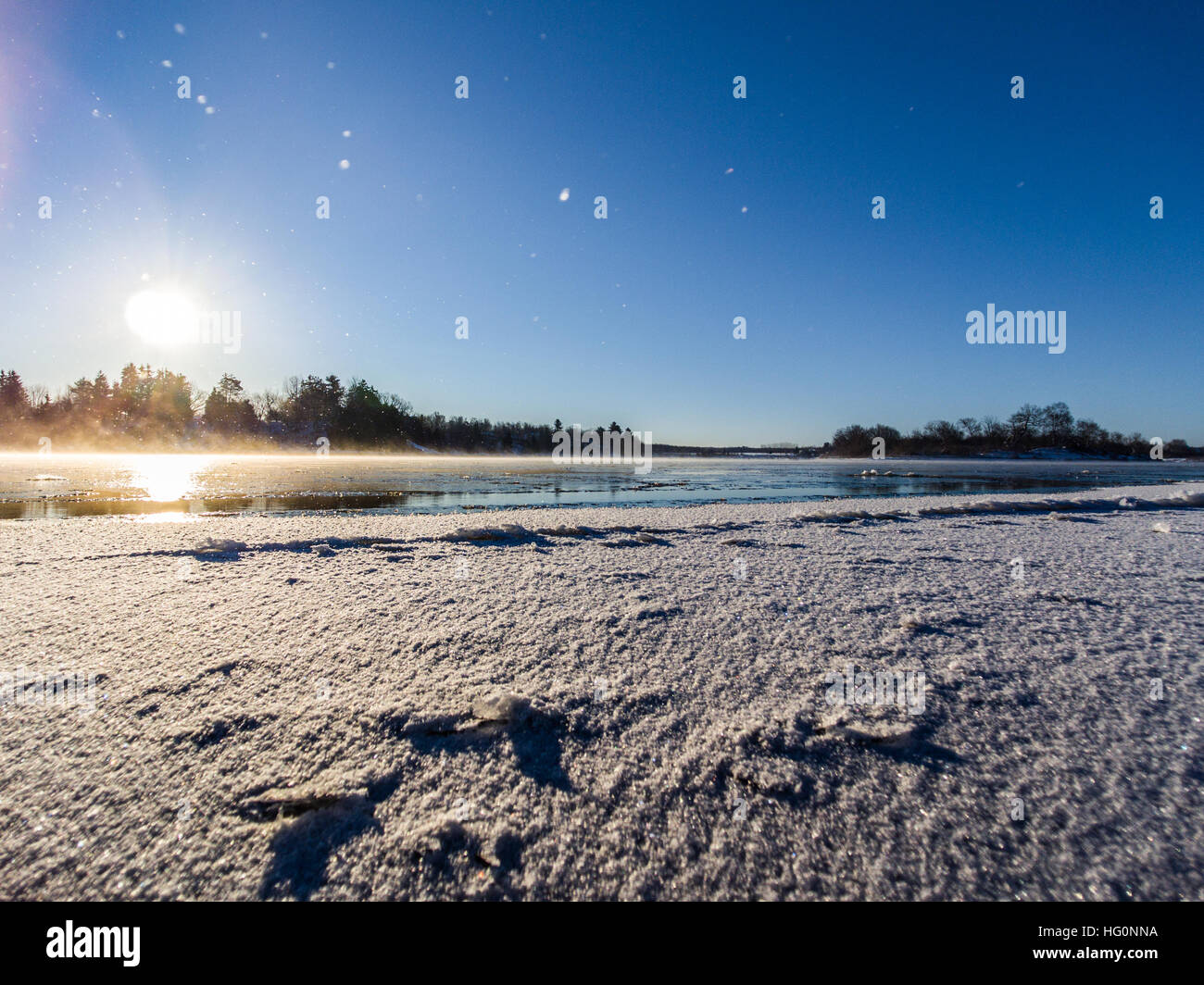Flying the drone over thin ice during sunrise Stock Photo