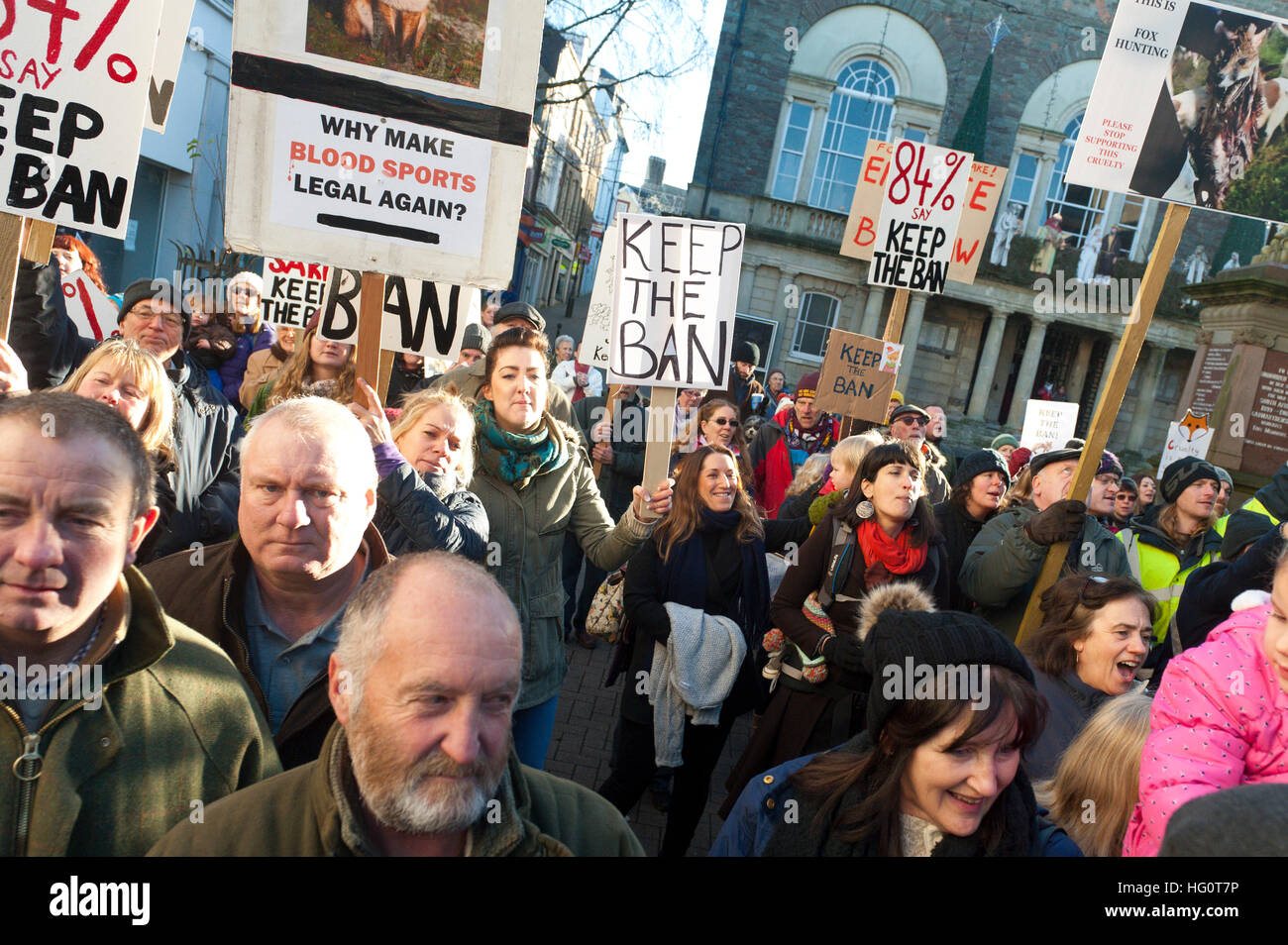 Carmarthen, Carmarthenshire, Wales, UK. 2nd January, 2016. Police keep hunt supporters and hunt protesters apart. Anti-Bloodsport activists gather in the Welsh town of Carmarthen to voice their anger at the continued illegal hunting with dogs - hunting with dogs was made illegal in 2004 by The Hunting Act 2004 (c37). The Anti-Hunt protest takes place on the day that the Carmarthenshire Hunt have chosen to parade through the town to collect money and support for their blood-sports. © Graham M. Lawrence/Alamy Live News. Stock Photo