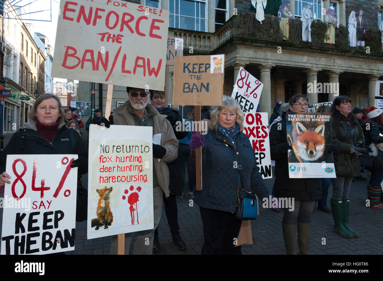 Carmarthen, Carmarthenshire, Wales, UK. 2nd January, 2016. Anti-Bloodsport activists gather in the Welsh town of Carmarthen to voice their anger at the continued illegal hunting with dogs - hunting with dogs was made illegal in 2004 by The Hunting Act 2004 (c37). The Anti-Hunt protest takes place on the day that the Carmarthenshire Hunt have chosen to parade through the town to collect money and support for their blood-sports. © Graham M. Lawrence/Alamy Live News. Stock Photo