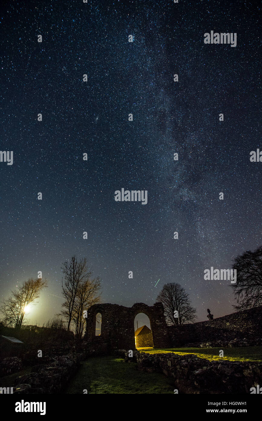 The Milky Way over Wales UK: On a cold clear and frosty night, with temperatures dropping to minus 5º celsius, the Milky Way is clearly seen as a thick band of stars across the skies above the arch shaped ruins of the medieval Strata Florida (Ystrad Fflur) Cistercian abbey in Pontrhydfendigaid, Ceredigion, mid Wales photo © keith morris/Alamy Live News Stock Photo