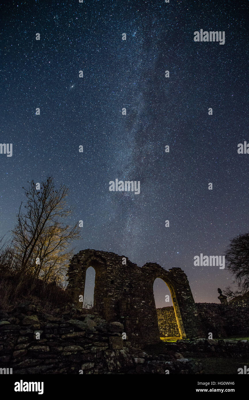 The Milky Way over Wales UK: On a cold clear and frosty night, with temperatures dropping to minus 5º celsius, the Milky Way is clearly seen as a thick band of stars across the skies above the arch shaped ruins of the medieval Strata Florida (Ystrad Fflur) Cistercian abbey in Pontrhydfendigaid, Ceredigion, mid Wales photo © keith morris/Alamy Live News Stock Photo