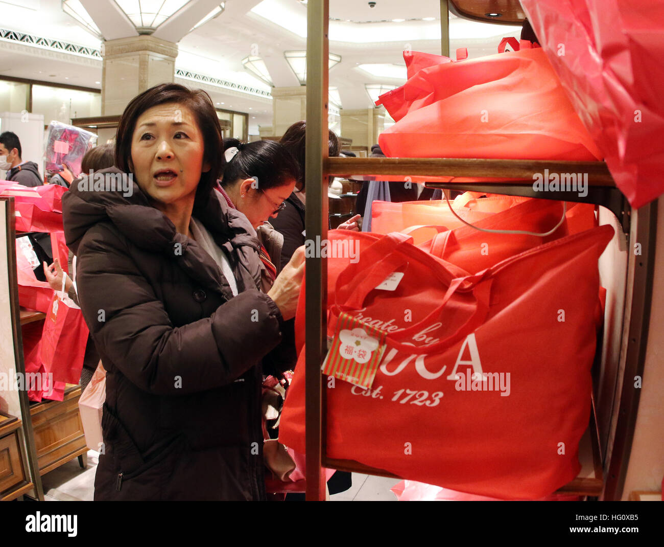 Tokyo Japan 2nd Jan 17 Japanese Shoppers Pick Up Lucky Bags Fukubukuro Containing Items Worth Several Times Their Price At The Mitsukoshi Department Store In Tokyo On Monday January 2 17