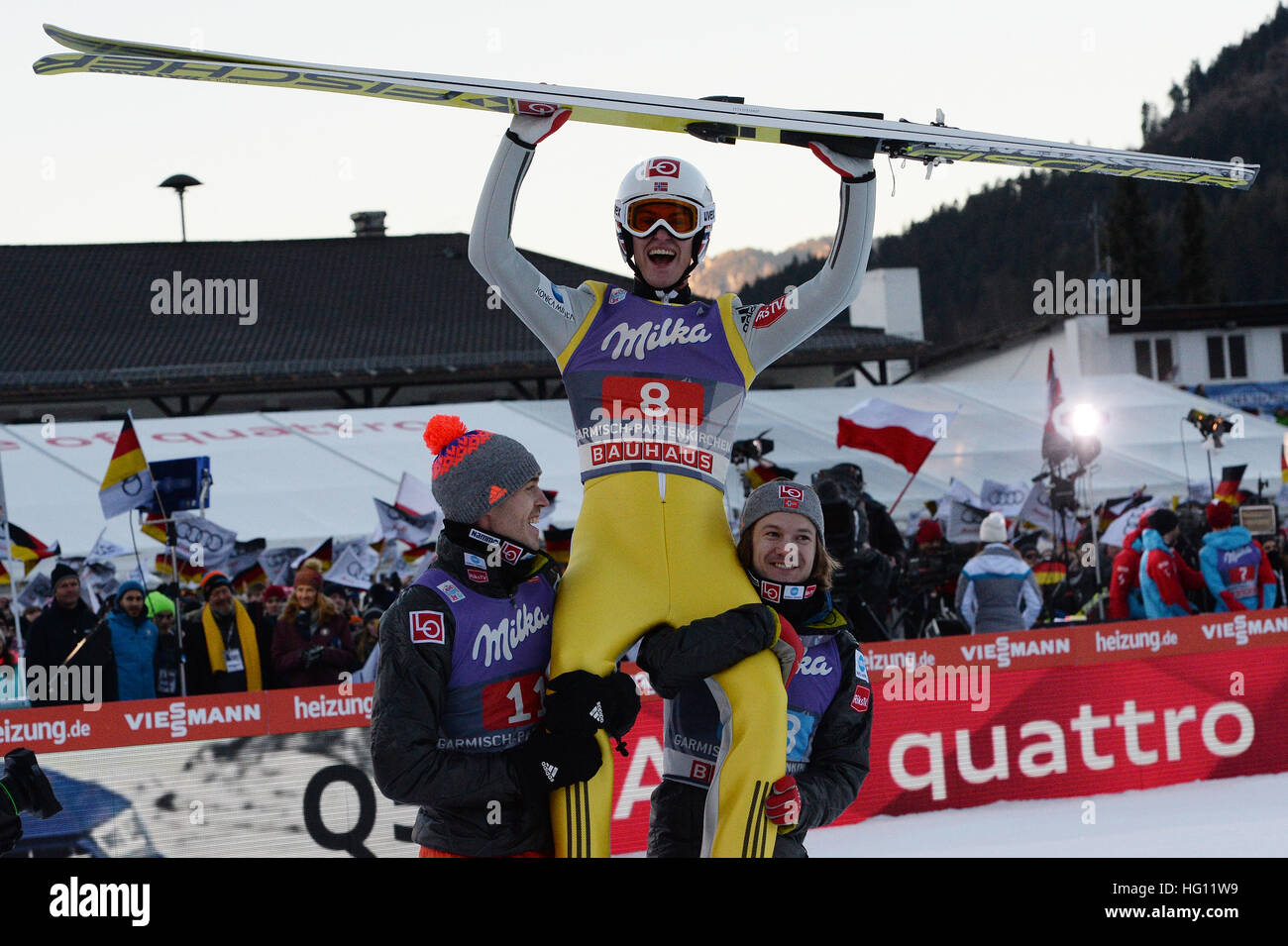01.01.2017, Olympic Hill, Garmisch Partenkirchen, Germany. 4 Hills ski jumping tournament. Norwegian ski jumper Daniel-Andre Tande (C) cheers after his victory in the New Year's jump next to teammates Andreas Stjernen (L) and Tom Hilde, who are lifting him up, at the Four Hills Tournament in Nordic skiing/ski jumping in Garmisch-Partenkirchen, Germany, 1st January 2017. Stock Photo