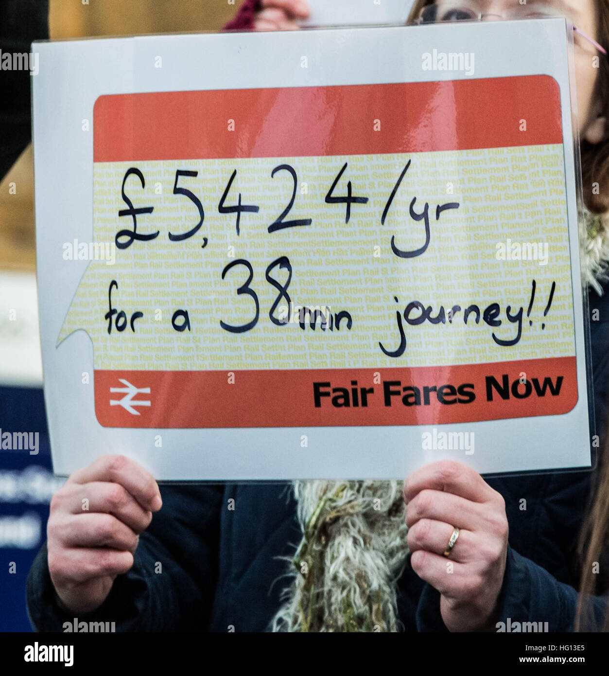 London, UK. 3rd Jan, 2017. Rail campaigners hold an early morning protest outside King's Cross station against fare increases. Commuters now face an average increase of 2.3% for rail travel in the new year © Guy Corbishley/Alamy Live News Stock Photo