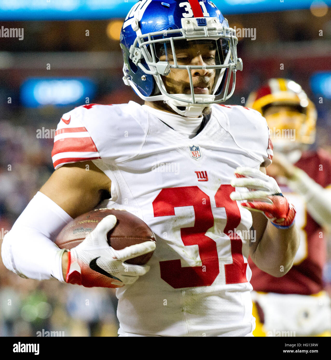 New York Giants cornerback Trevin Wade (31) returns a fumble on the