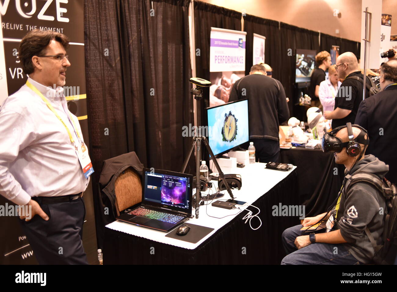 Las Vegas, Nevada, USA, 2nd January, 2017.  People gather around Vuze booth during 'CES Unveiled,' a media preview event for the CES (Consumer Electronics Show). Vuze is showing off 360-degree camera.  CES, the world's largest annual consumer electronics trade show, runs from January 5-8 and is expected to feature 3,800 exhibitors showing off their latest services and products to more than 165,000 attendees representing more than 150 countries.  John D. Ivanko/Alamy Live News Stock Photo