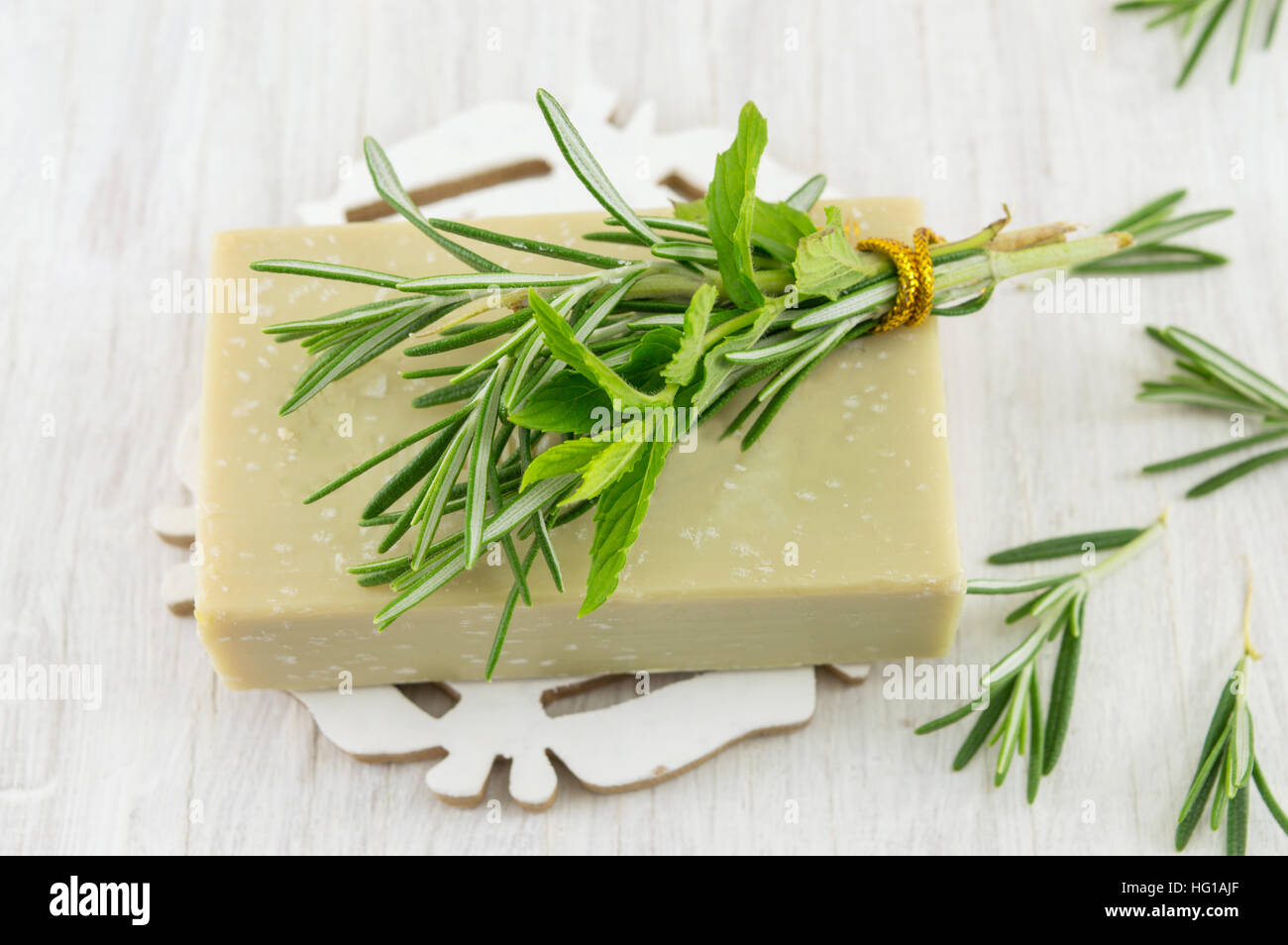 Herbal soap with rosemary and mint leaves bouquet Stock Photo