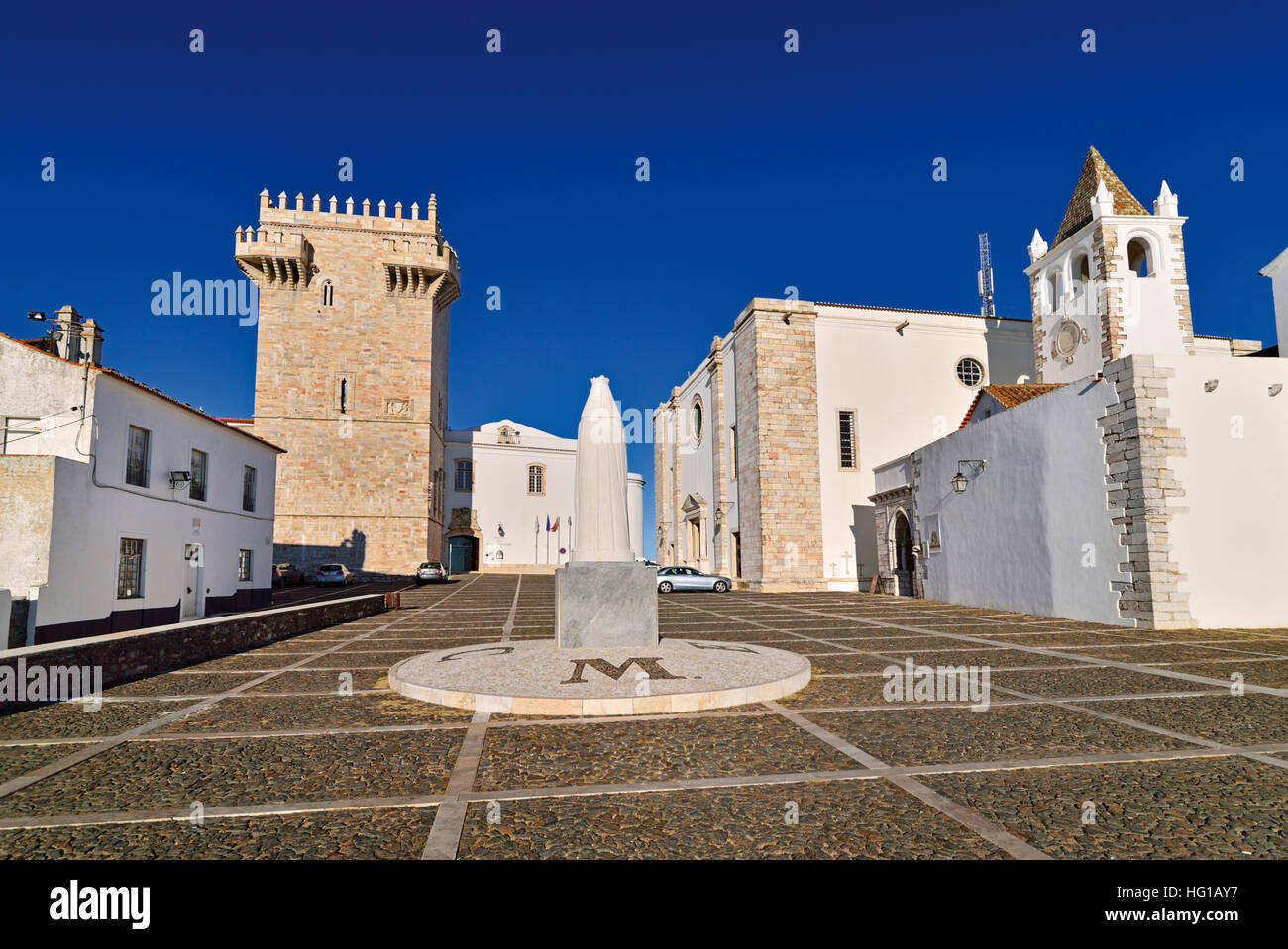 Portugal: Patio in the historic part of marble town Estremoz with tower and Palace Rainha Santa Isabel Stock Photo