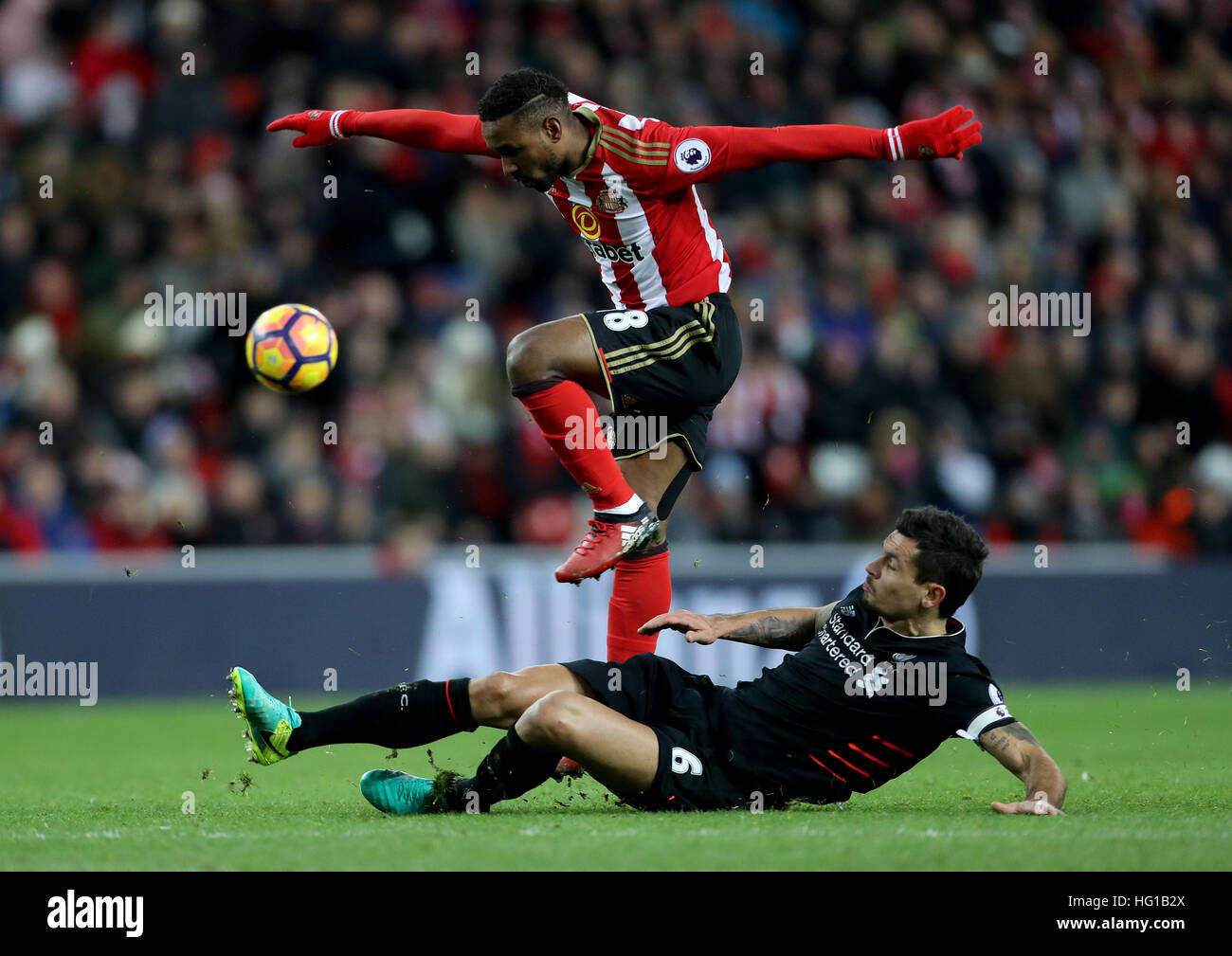 Liverpool's Dejan Lovren (bottom) and Sunderland's Jermain Defoe battle ...