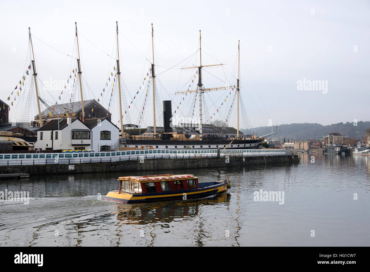 A pedestrian ferry passing SS Great Britain dock on the floating harbour in Bristol Avon England UK Stock Photo