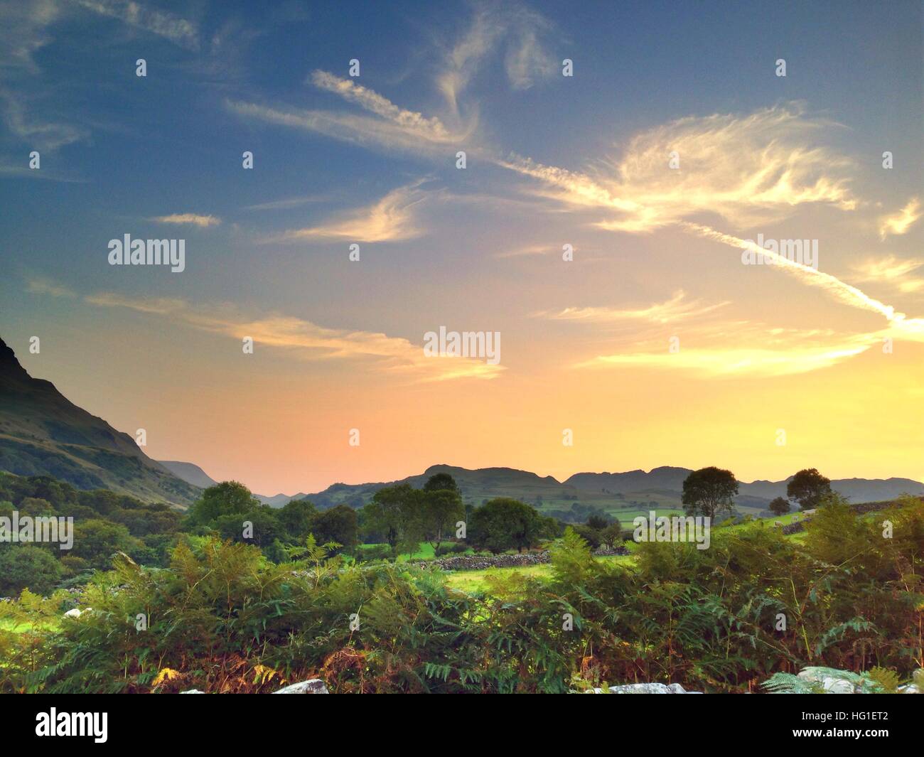 Magnificent sunset over a mountain range Stock Photo - Alamy