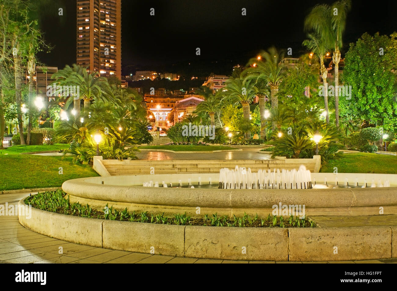 The evening walk in French style gardens of Monte Carlo, located opposite the Casino Square, Monaco. Stock Photo