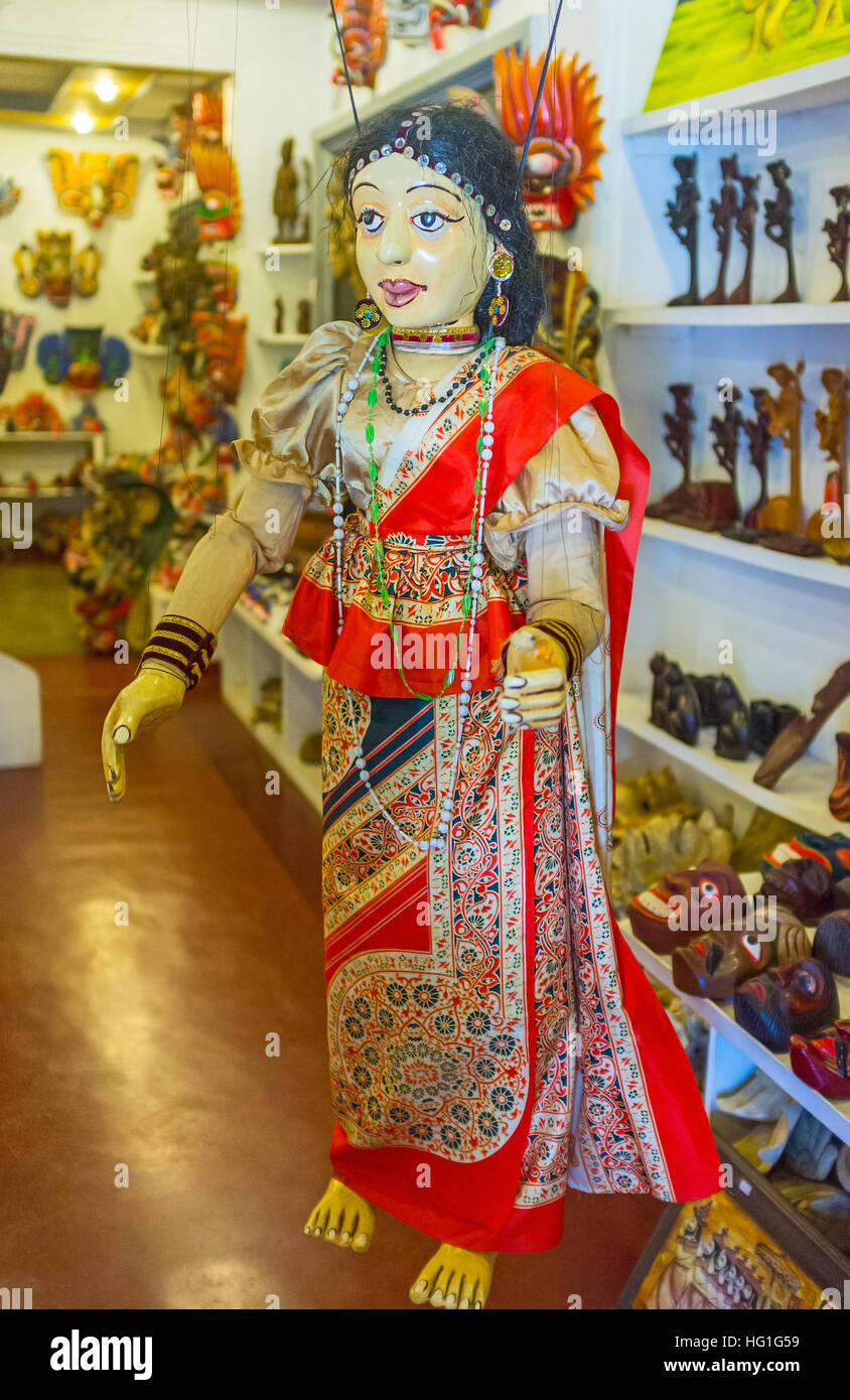 The female puppet in traditional colorful sari in the mask store Stock Photo