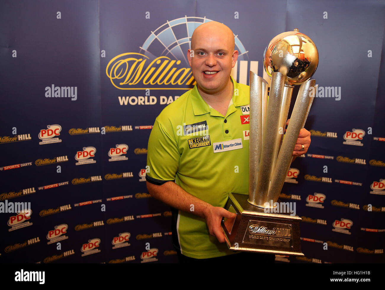 Michael van Gerwen celebrates with the Sid Waddell trophy during day  fifteen of the William Hill World Darts Championship at Alexandra Palace,  London Stock Photo - Alamy