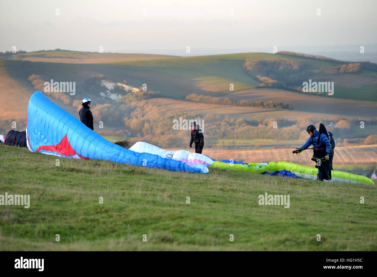 Paragliders setting up on the South Downs in East Sussex Stock Photo