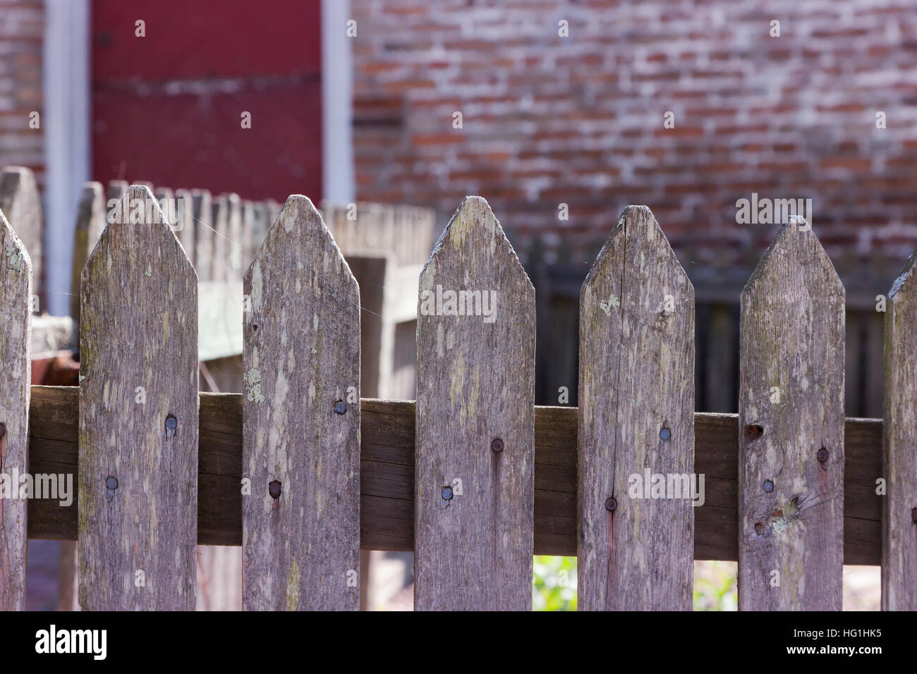A closeup of an old, weathered fence. The wood is weathered. Stock Photo