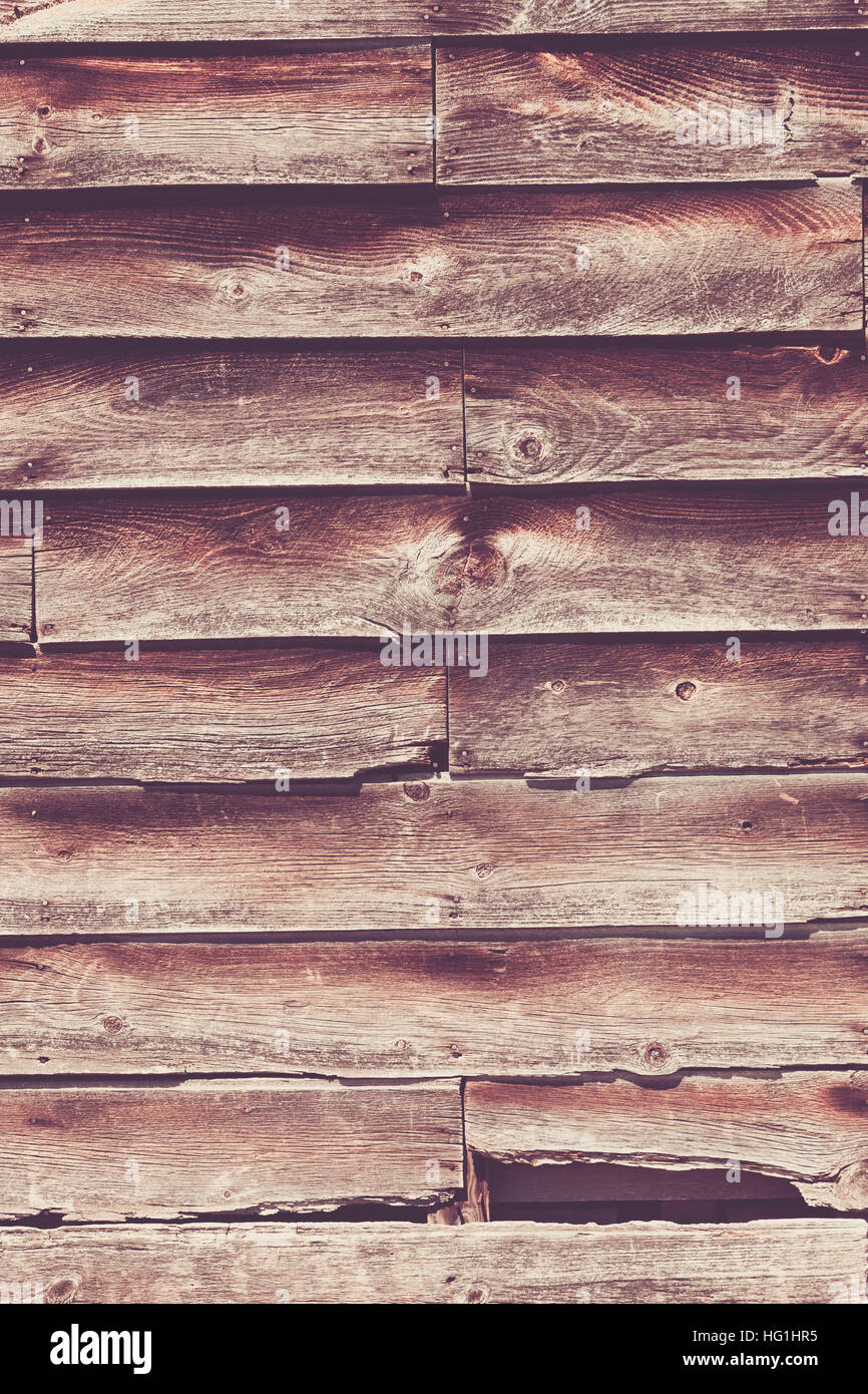 Old, rustic wood siding on an old building, background Stock Photo