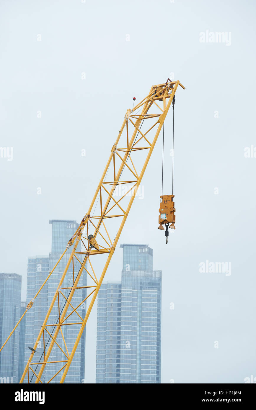 End part and hook of tower crane at a construction site. Stock Photo