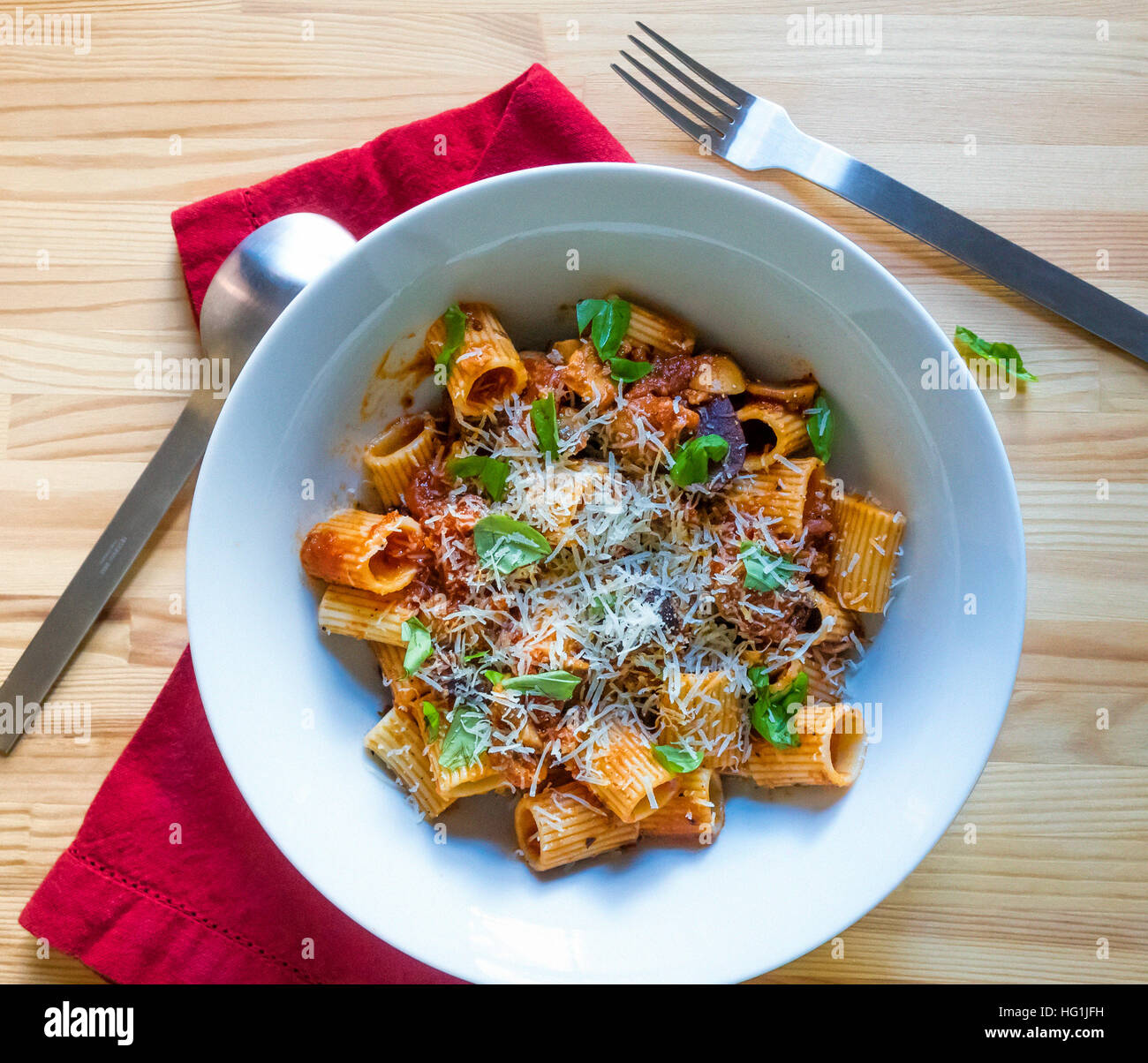 Rigatoni pasta with mushrooms, tomatoes, basil and Parmigano Reggiano
