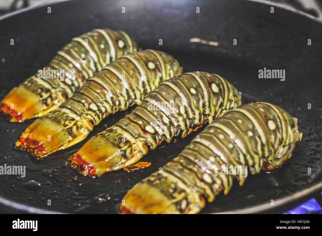 Photograph of four lobster tails ready to eat Stock Photo Alamy