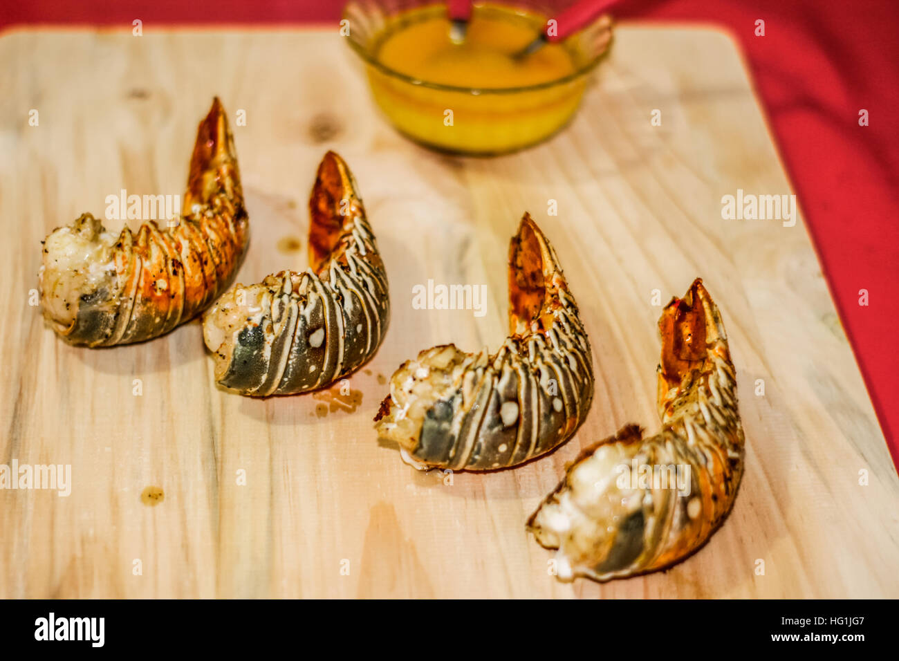 Photograph of four lobster tails ready to eat Stock Photo Alamy