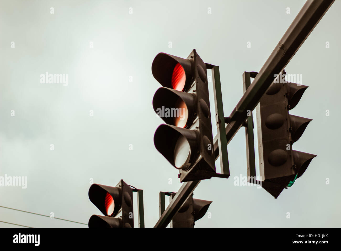 Photograph of some Traffic lights and cloudy sky Stock Photo