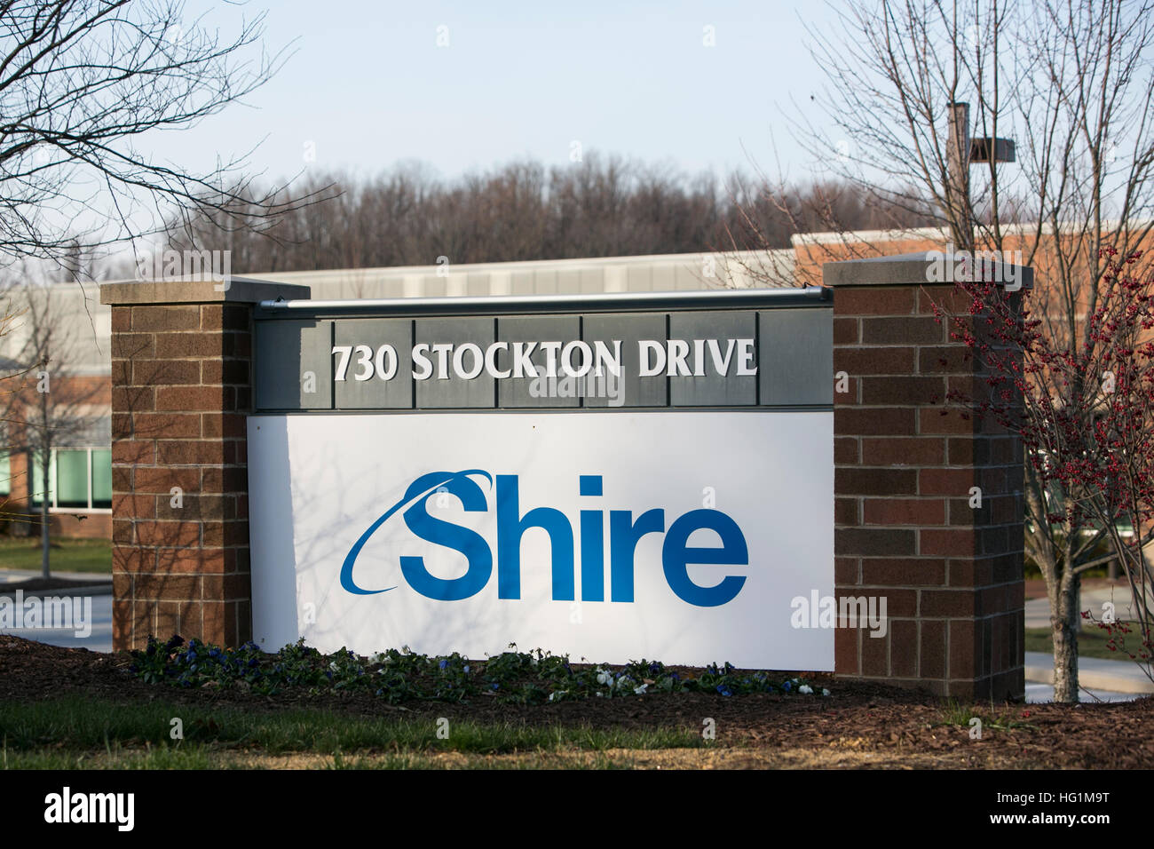 A logo sign outside of a facility occupied by Shire Plc in Exton