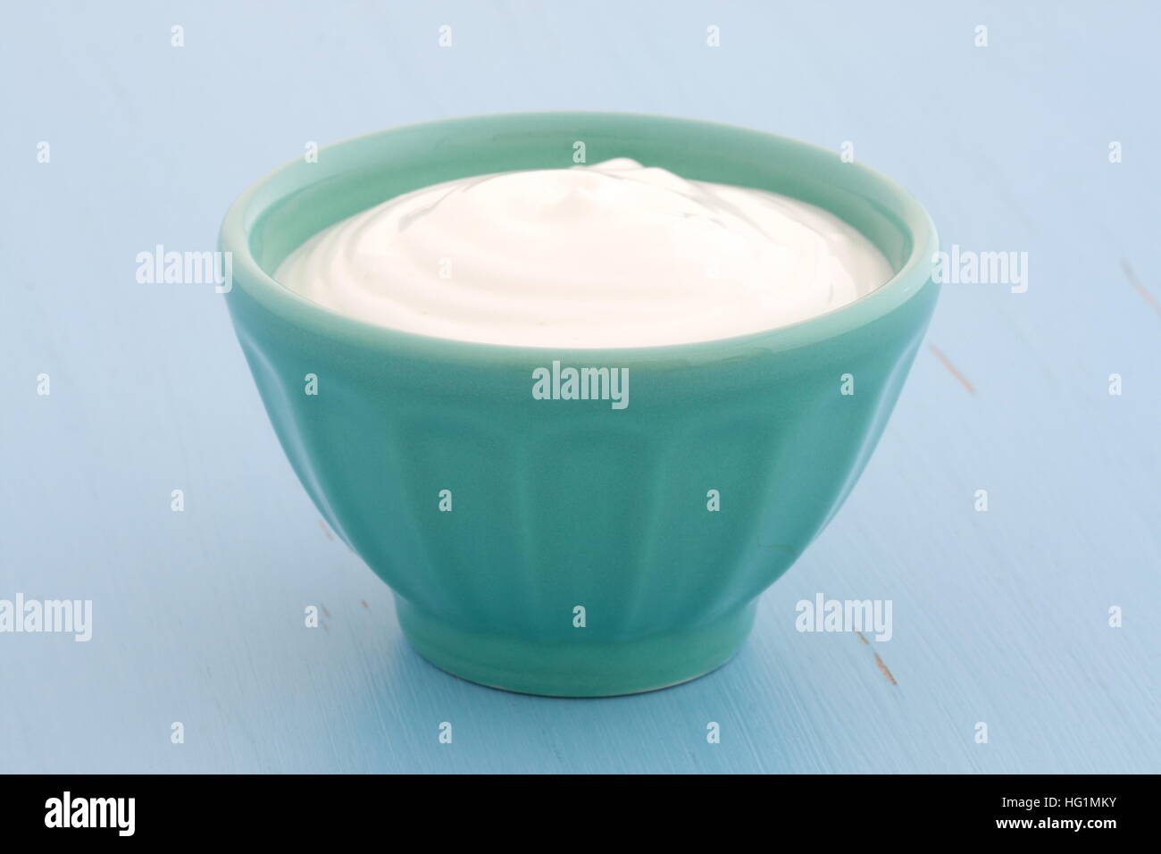 Delicious, nutritious and healthy fresh plain greek yogurt on antique