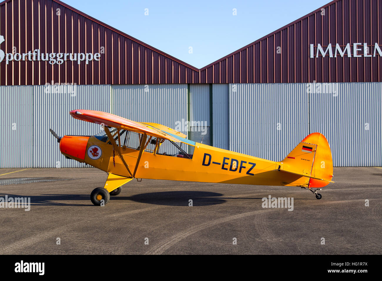 Bremgarten, Germany - October 22, 2016: A classic yellow Piper Cub aircraft parked at the airport Stock Photo