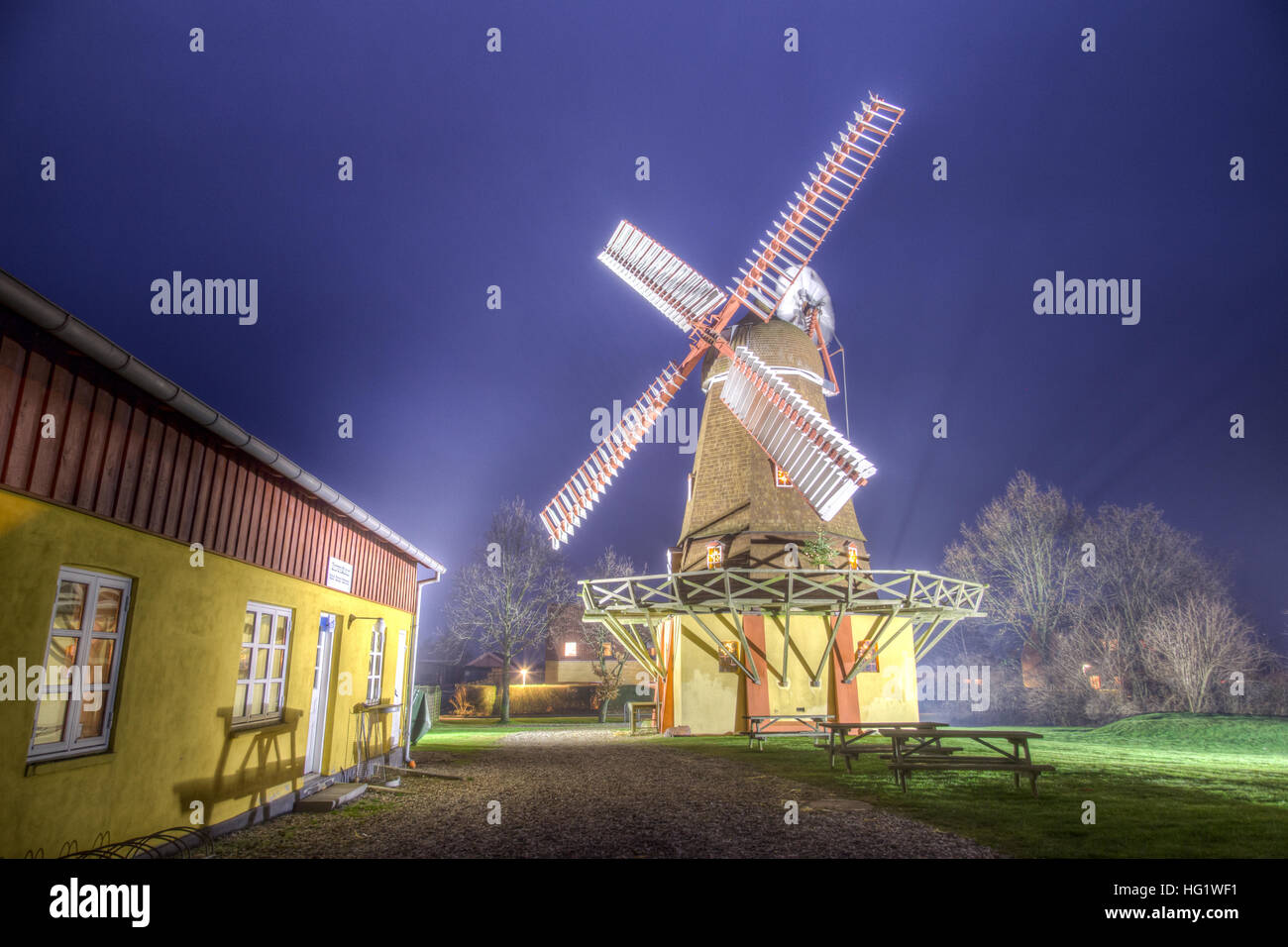 Ramloese, Denmark - December 30, 2016: HDR photo of an illuminated historic Danish windmill Stock Photo