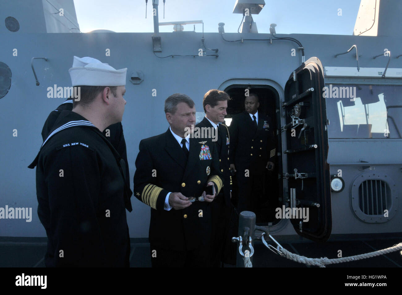 Adm. William Gortney, commander U.S. Fleet Forces Command, talks to sailors aboard amphibious transport dock ship USS New York (LPD 21). New York shifted home port to Naval Station Mayport, Fla., as part of a larger move of an amphibious ready group home port change in support of strategic maritime dispersal. (U.S. Navy photo by Mass Communication Specialist 3rd Class Angus Beckles/Released) USS New York arrives at Mayport 131206-N-GC472-046 Stock Photo