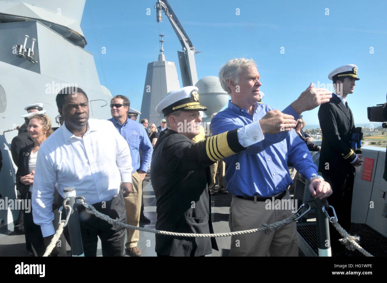 Adm. William Gortney talks with United States Congressman Ander Crenshaw, Florida 4th District, while Mayor Alvin Brown, mayor of Jacksonville, looks on aboard amphibious transport dock ship USS New York (LPD 21). New York shifted home port to Naval Station Mayport, Fla., as part of a larger move of an amphibious ready group home port change in support of strategic maritime dispersal. (U.S. Navy photo by Mass Communication Specialist 3rd Class Angus Beckles/Released) USS New York arrives at new home port 131206-N-GC472-225 Stock Photo