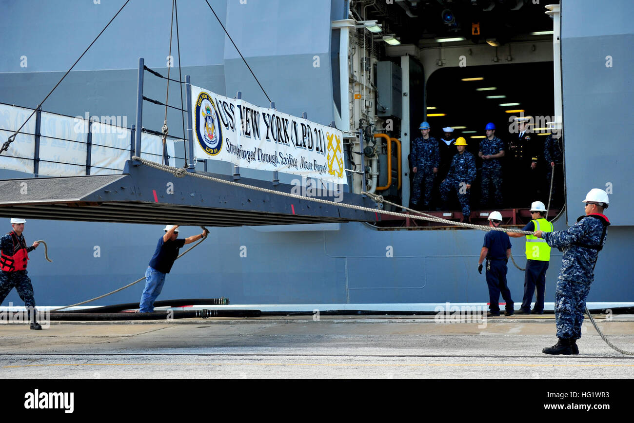 131206-N-MJ645-329 MAYPORT, Fla. (Dec. 6, 2013) Sailors and Navy civilian employees set up the brow aboard the San Antonio-class amphibious transport dock ship USS New York (LPD 21) as the ship arrives at Naval Station Mayport, its new homeport. The homeport change is part of a larger move of the Iwo Jima Amphibious Ready Group homeport change in support of strategic dispersal and two viable East Coast surface ship homeports as well as the preservation of the ship repair industrial base in those areas. (U.S. Navy photo by Mass Communication Specialist 2nd Class Marcus L. Stanley/Released) USS  Stock Photo