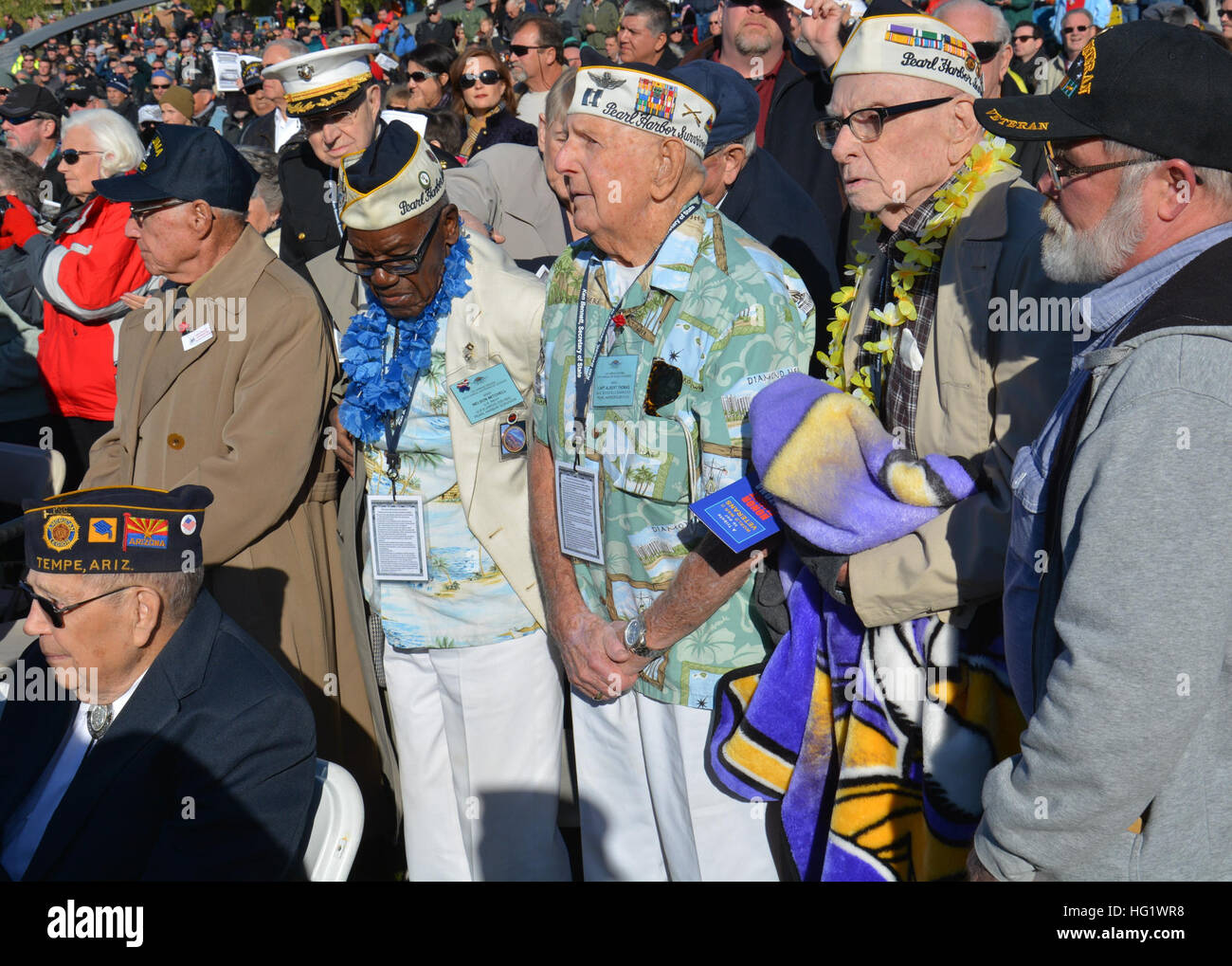 Three of the nine living survivors of the USS Arizona, all in their nineties, are honored during a WWII memorial ceremony in Phoenix on Saturday, the 72nd anniversary of the attack on Pearl Harbor in Hawaii. The memorial features nine blue steel columns and gun barrels salvaged from two famed battleships, the USS Arizona and the USS Missouri. (U.S. Navy photo by Mass Communications Specialist 3rd Class Drew Verbis/Released) WWII, USS Arizona Memorial dedication in Phoenix 131207-N-AS200-023 Stock Photo
