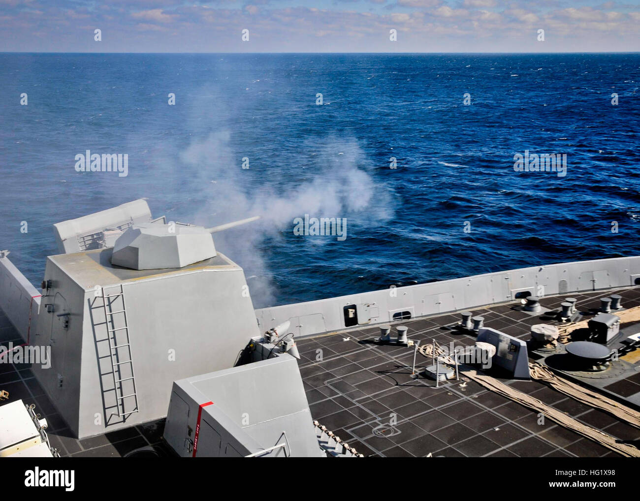 The amphibious transport dock ship USS New York (LPD 21) fires its MK46 30mm gun during a live-fire exercise. (U.S. Navy photo by Mass Communication Specialist 2nd Class Cyrus Roson/Released) USS New York live-fire exercise 140122-N-YO707-177 Stock Photo