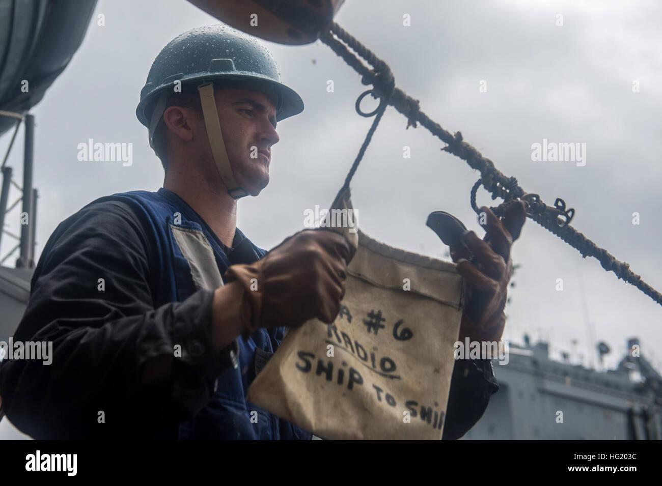 Boatswain’s Mate 3rd Class John Sutcliffe, from Philadelphia, participates in a replenishmentat
