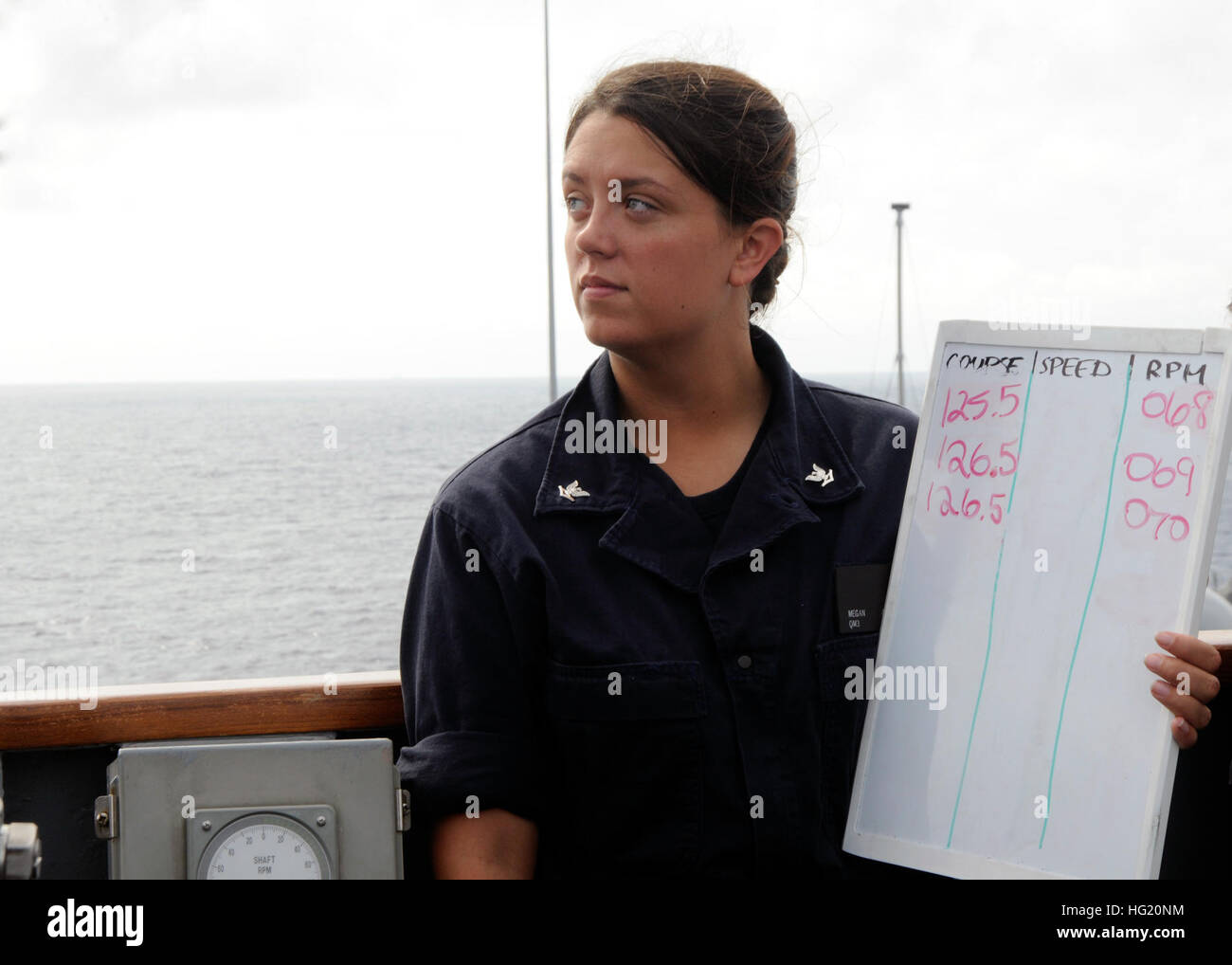 Quartermaster 3rd Class Megan Anderson displays a navigation status board during a replenishment-at-sea between U.S. 7th Fleet flagship USS Blue Ridge (LCC 19) and USNS Washington Carver (SSBN-656). Blue Ridge is currently on patrol in the Indo-Asia-Pacific with embarked 7th Fleet staff, Helicopter Sea Combat Squadron 12 and Marines from Fleet Antiterrorism Security Team Pacific.  (U.S. Navy Photo by Mass Communication Specialist 2nd Class Jeff Troutman) USS Blue Ridge activity 140811-N-ON468-219 Stock Photo